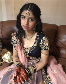 Photo: Teen girl in sari sitting.
